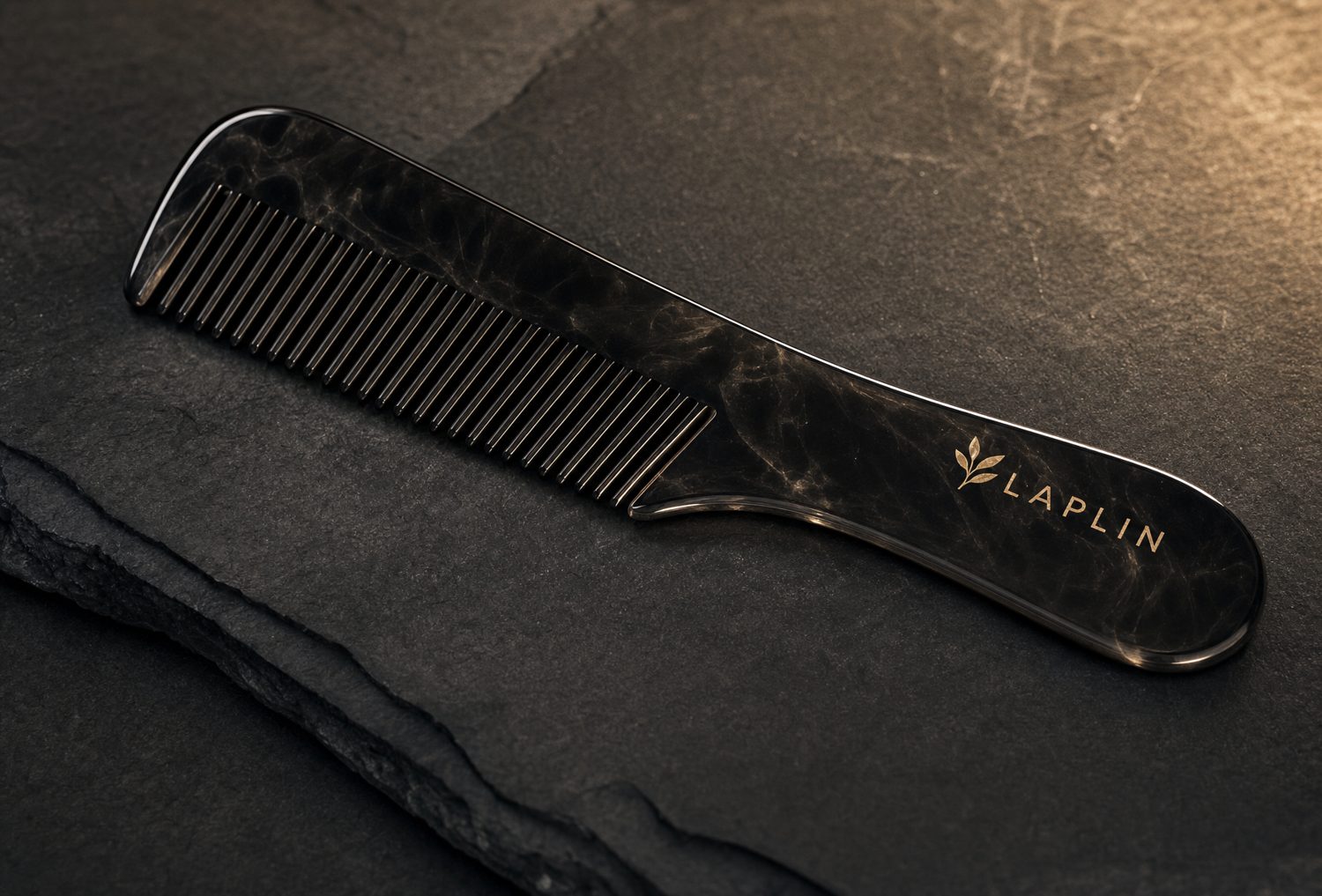 A polished obsidian LAPLIN comb.